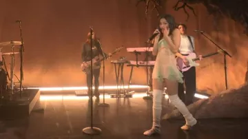 Miu Miu Satin Logo Strap Ballet Flats worn by Olivia Rodrigo as seen in Saturday Night Live (S51E18)