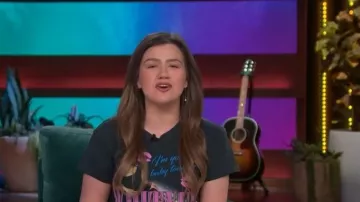 Daydreamer Whitney Houston Your Baby Tonight Tour Tee worn by Kelly Clarkson as seen in The Kelly Clarkson Show on May 19, 2026