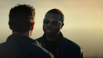 Prada PR 67ZS Pale Gold Metal Frame Sunglasses worn by Coltrane Wilder (Y'lan Noel) as seen in Nemesis (S01E02)