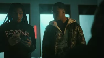 Tan Camo Denim Tears The Cotton Wreath Zip Sweatshirt worn by Bakari (Ahmad N. Ferguson) as seen in The Chi (S08E02)