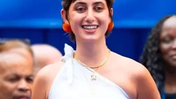 NBA Finals 2026 Rama Duwaji Off-shoulder Top worn by Rama Duwaji in Mamdani's Wife Turns Heads at Championship Celebration with Over-the-Top Knicks Attire