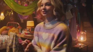 Multicolored heart sweater worn by Enid Sinclair (Emma Myers) in Wednesday (S01E06)