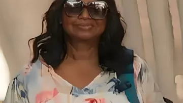 Ride or Die 2026 Octavia Spencer Floral Print Top worn by Debbie Claybourne (Octavia Spencer) as seen in Ride or Die (S01)