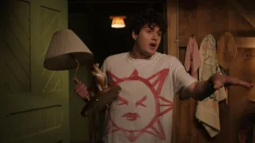 Our Legacy Box Squinting Sun Graphic T-Shirt worn by Conner (Keen Ruffalo) as seen in Sterling Point (S01E03)