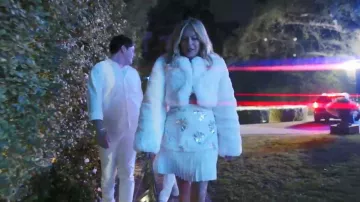 Robe mini plissée à nœud Rebecca Vallance Valor portée par Sutton Stracke dans l'épisode « The Real Housewives Ultimate Girls Trip » (S05E03)