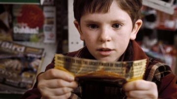 The winning ticket Wonka Charlie Bucket (Freddie Highmore) in Charlie and the Chocolate factory