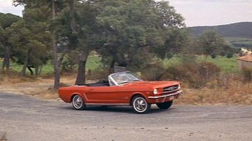 The red Ford Mustang convertible driven by Ludovic Cruchot (Louis de Funès) in the film Le Gendarme de Saint Tropez