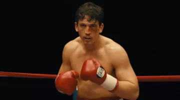 The boxing gloves red, Cleto Reyes of Vinny Pazienza (Miles Teller in Bleed for This