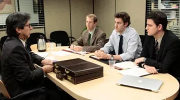 The apple laptop computer seen in The office