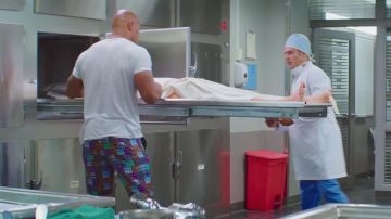 The shorts, bright colors of Mitch Buchannon (Dwayne Johnson) in Baywatch : baywatch