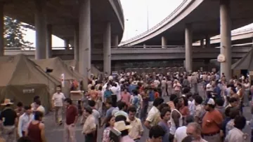 The reception of refugees under the Santa Monica Freeway in Los Angeles in Scraface