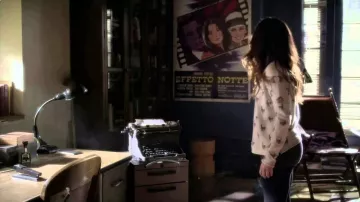 The poster for the film The American Night in the apartment of Ezra Fitz (Ian Harding) on Pretty Little Liars S04E01