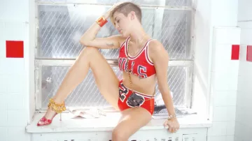 Chanel Black Leather Mini Bag worn by Miley Cyrus in 23 Clip by Mike WiLL Made-It