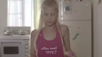 The pink top Who need Tits Yolandi Visser in the movie clip Baby s on fire Die Antwoord