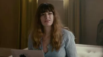 The sticker wave off Kanagawa on the computer, and Gloria (Anne Hathaway) in Colossal