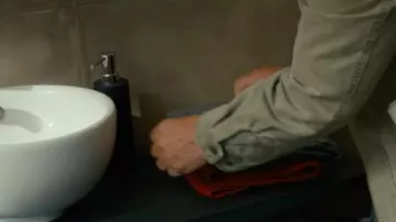 The soap dispenser in the toilet of the apartment in the background!