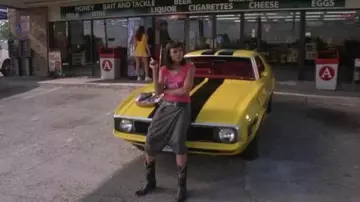 The santiag-style cowboy boots worn by Abernathy (Rosario Dawson) in the movie Death Boulevard