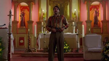 the shirt gaily to Pacho Herrera (Alberto Ammann) in Narcos season 3