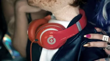 The audio headphones red Beats by Dr Dre seen in the clip Sing Ed Sheeran