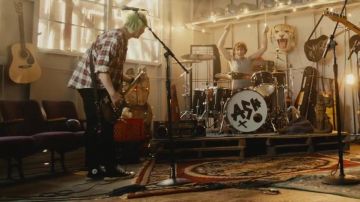 The pair of Converse Chuck Taylor All Star in the clip Amnesia by 5 Seconds of Summer