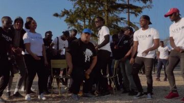 The converse chuck taylor black in the clip The Riot of Naza