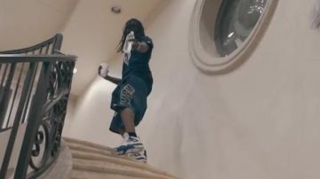 The pair of Nike Air Jordan 4 Motorsport in the clip Mailbox Chief Keef