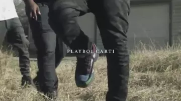 The pair of Adidas X Raf Simons Ozweegos in the clip Magnolia Playboi Carti