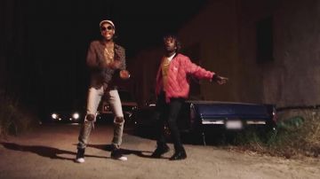 The pair of Converse high tops black, in the clip Pull Up (feat. Lil Uzi Vert) Wiz Khalifa