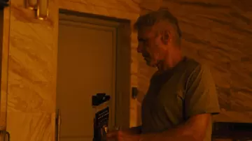 The bottle of Johnnie Walker whiskey open by Rick Deckard (Harrison Ford) in Blade Runner 2049