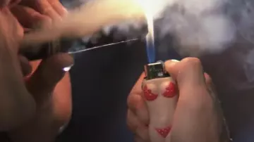 The lighter woman in a bikini, Max Cady (Robert De Niro) in The Nerves