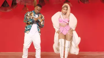 The waders in the white Nicki Minaj in her video clip Rake it up