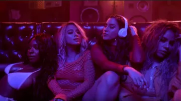 The orange robes of Ally Brooke in the clip He like that of Fifth Harmony