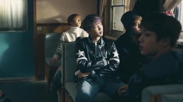 The bomber leather black Givenchy in the clip Spring Day BTS