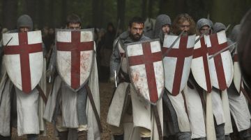 The shield of a knight Templar, Landry (Tom Cullen) in Knightfall