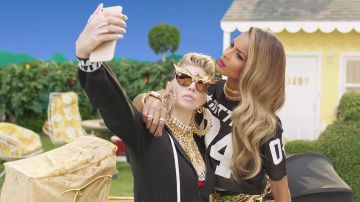 The iPhone 6s plus gold in the clip M. I. L. F. $ Fergie