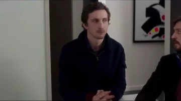 The navy blue jumper of Nicholas (Baptiste Lecalpain) in The Currency Of Their Room