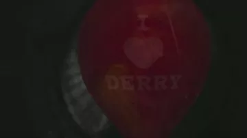 Red balloon "I Love Derry" of Pennywise clown (Bill Skarsgård) as seen in It movie