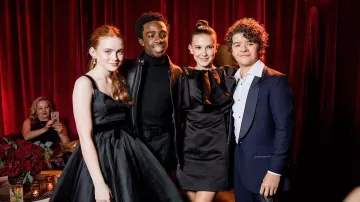 The black dress satin Calvin Klein Millie Bobby Brown at the Golden Globes 2018