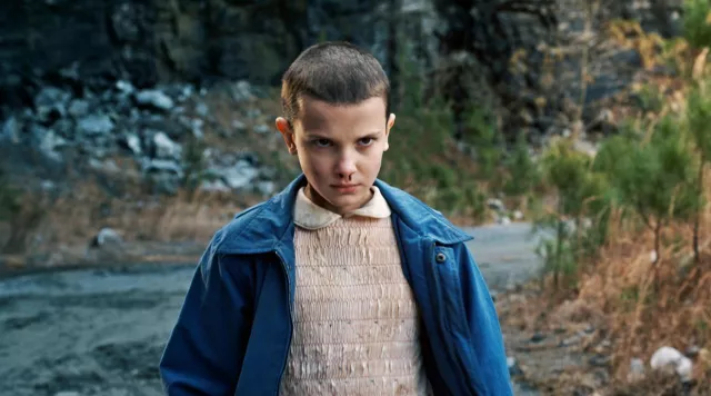 Eleven's (Millie Bobby Brown) vintage pink dress in the series Stranger Things (Season 1 Episode 3)