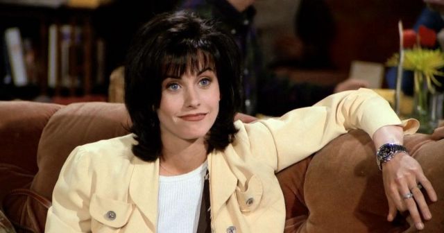 The jacket is pale yellow worn by Monica Geller (Courtney Cox) in Friends S01E01