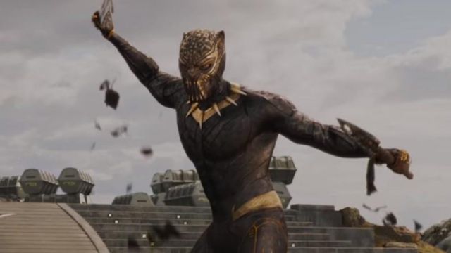 The trademark gold mask of the Jaguar by Killmonger (Michael B. Jordan) in a Black Panther
