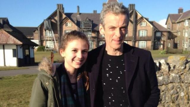 The black sweater with the hole of Peter Capaldi on a photo of a fan