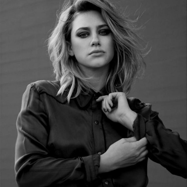 The shirt " - style bomber worn by Lili Reinhart during a photo shoot in black and white