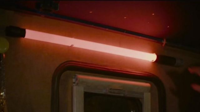 The baton neon, bright red color in the movie Alibi.com