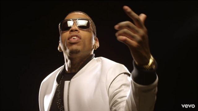 The jacket in white from Kid Ink in his clip Show Me