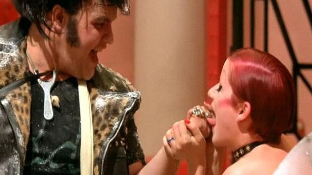 The ring with the masks of comedy brought by Eddie (Meat Loaf) in The Rocky Horror Picture Show
