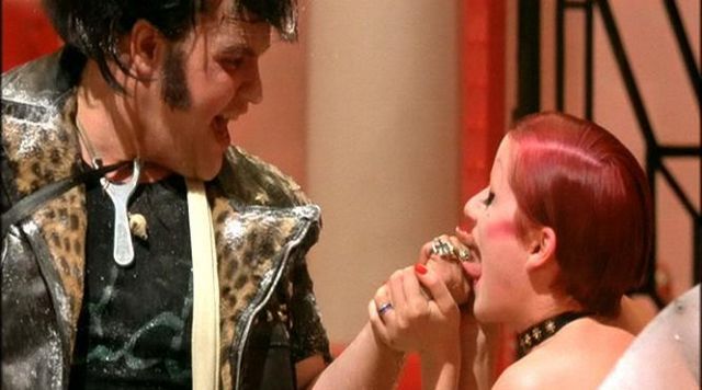 The gold ring with oval stone tiger eye of Eddie (Meat Loaf) in The Rocky Horror Picture Show
