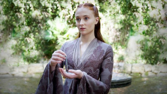 Sansa Stark's (So­phie Tur­ner) plum dress as seen in Game of Thrones 3x01
