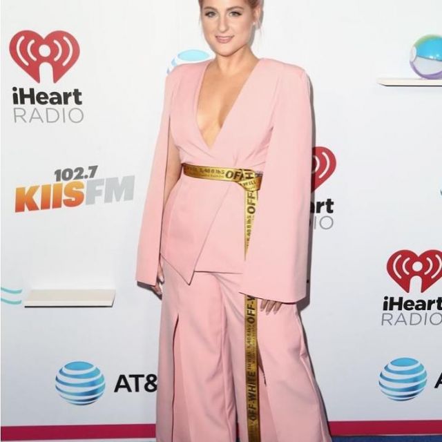 The open Pants in front of pink Meghan Trainor on her account Istagram