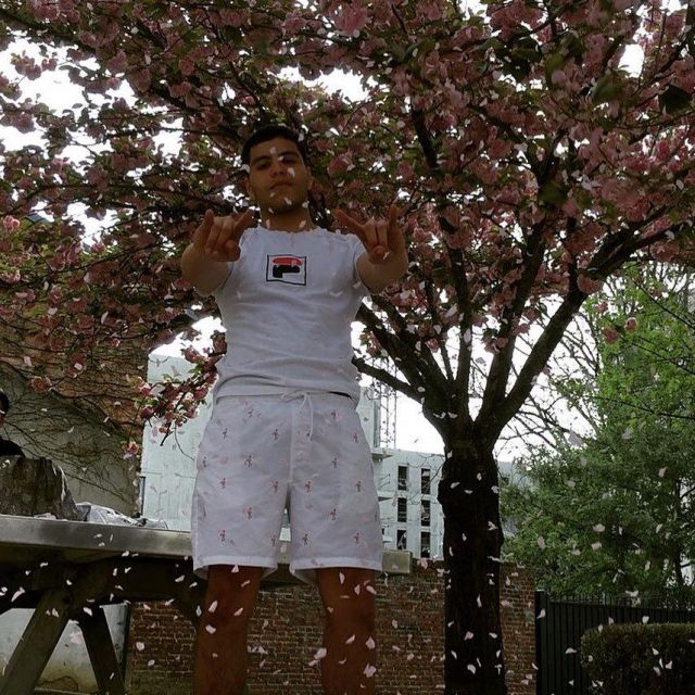 The white t-shirt with Fila on the account Instagram @ahmed93120